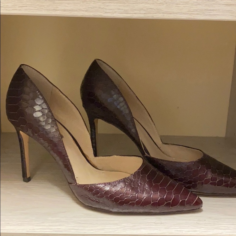Maroon snakeskin pumps